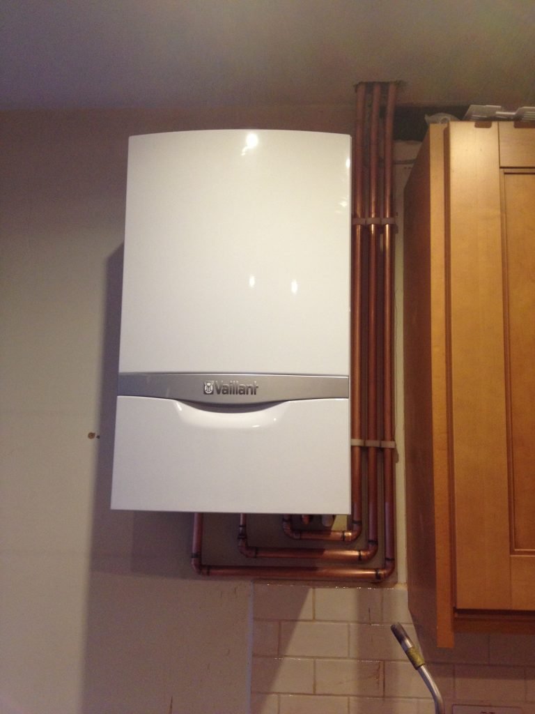 Vaillant boiler installed on a kitchen wall as part of a central heating upgrade